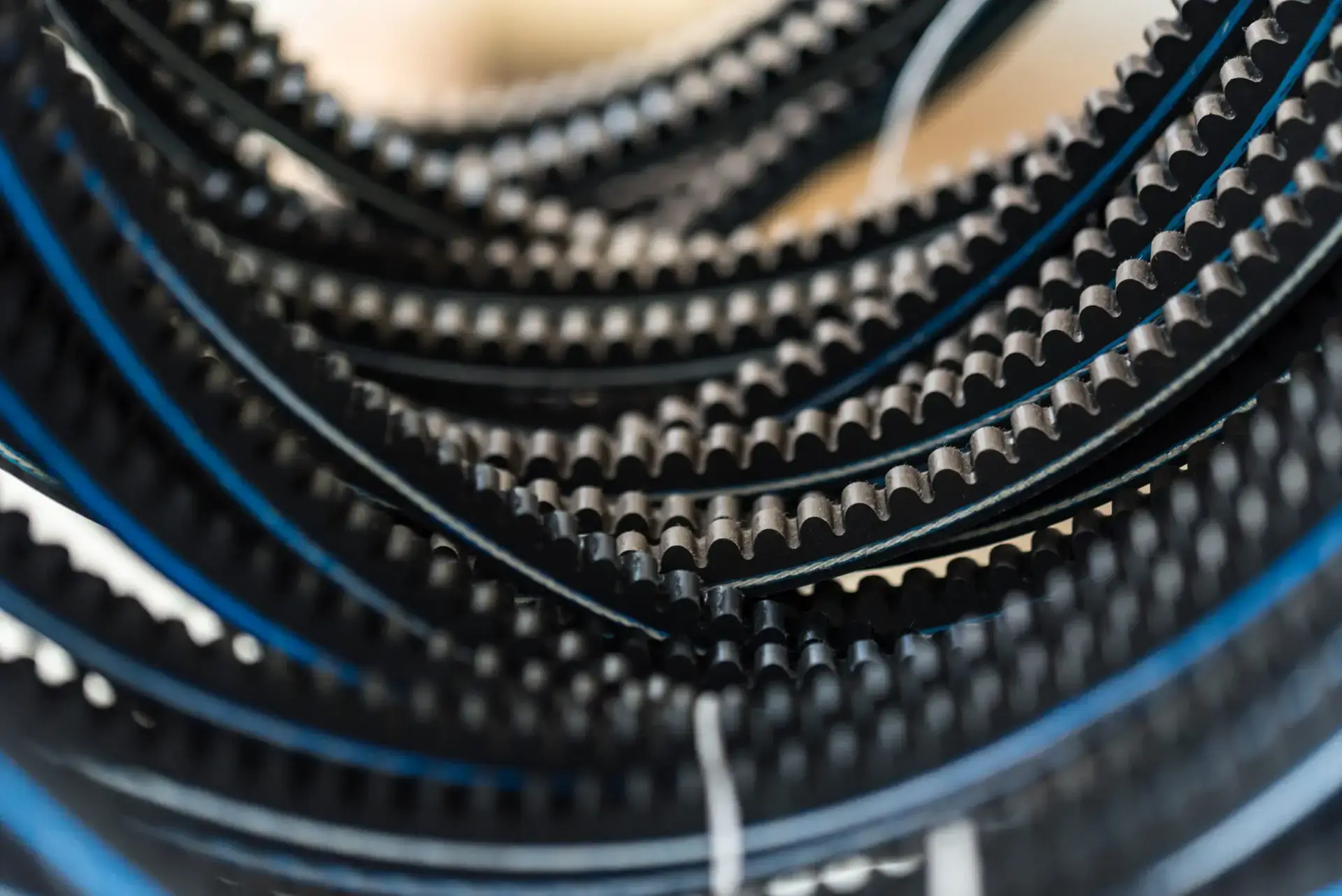 closeup-old-timing-belts-rubber-spare-parts-2023-11-27-05-18-25-utc-scaled